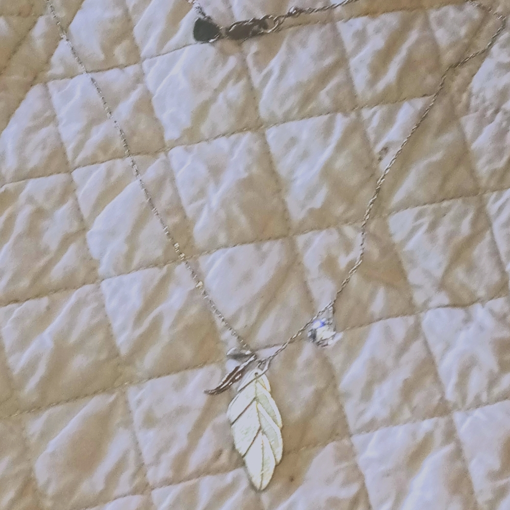 Beautiful handmade necklace with 3 charms